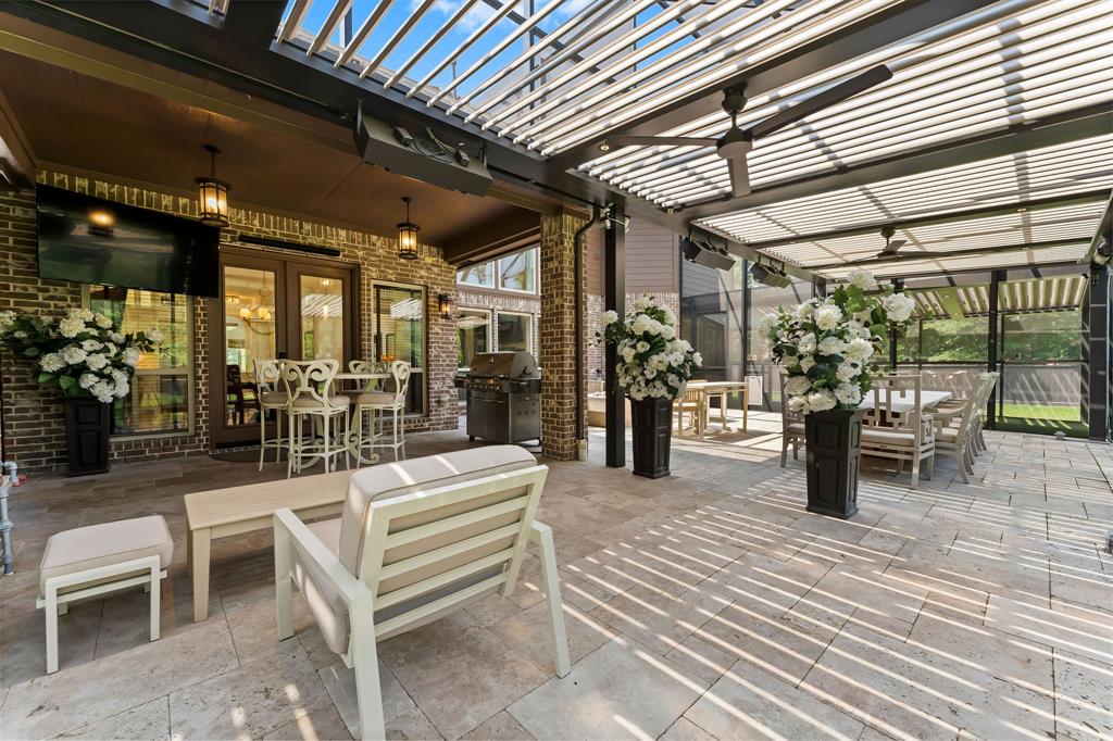 The Owner added almost 1,000 square feet of screened in, covered outdoor living and entertainment space. The speakers are carefully located throughout the space to enjoy your favorite playlist.