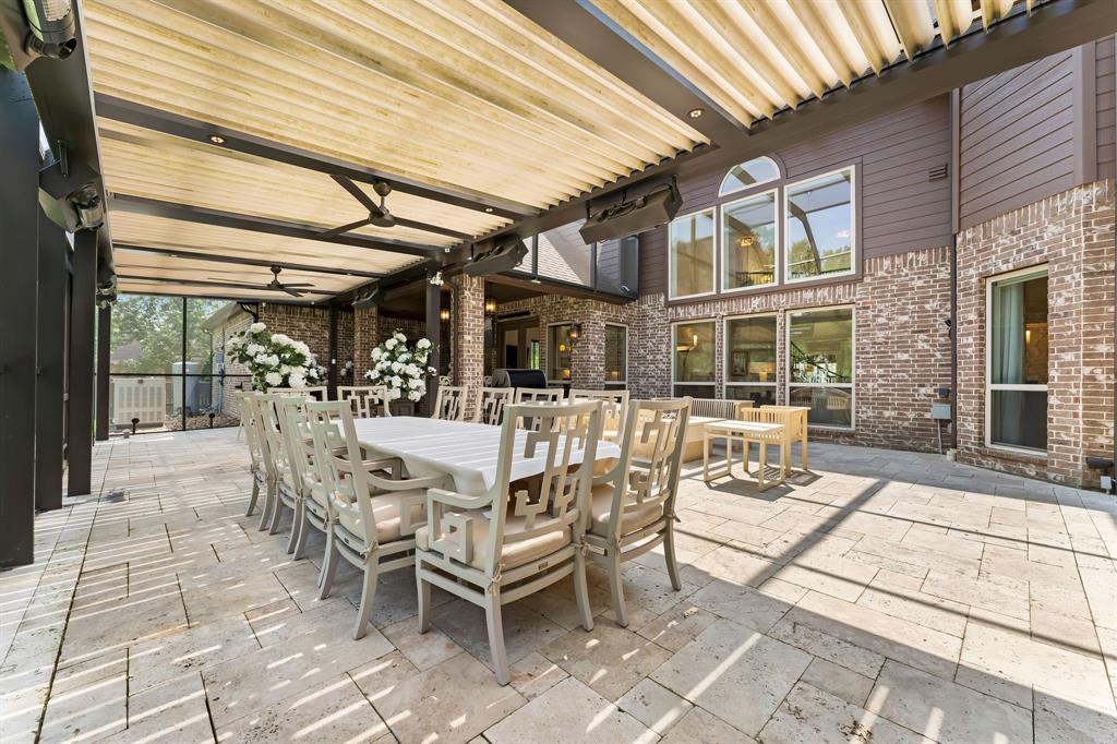 The Louvered Roof System on the back patio Lanai, which is completely screened in, makes entertaining in all weather elements possible. You can control how much sun or shade you'd like, and you can close them completely when it rains.