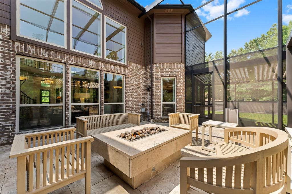 Enjoy a nice evening on the patio around the custom built in fire table.