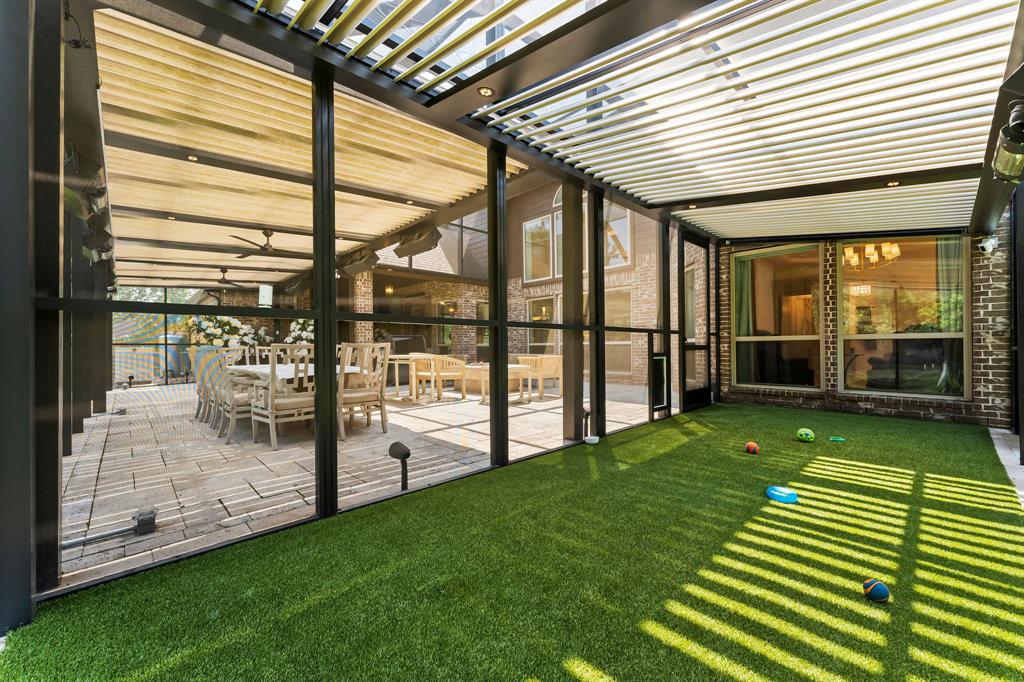 The dog run is covered and features drainable K9Grass, making it convenient to keep the area clean. It also houses the 8th heating/misting system to keep your four-legged family members as comfortable as you are.