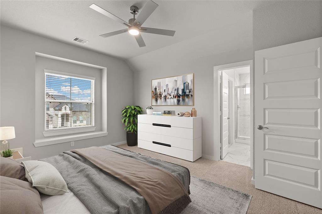 Secondary bedroom features plush carpet, custom paint, ceiling fan with lighting, large window with privacy blinds and access to a private bath.