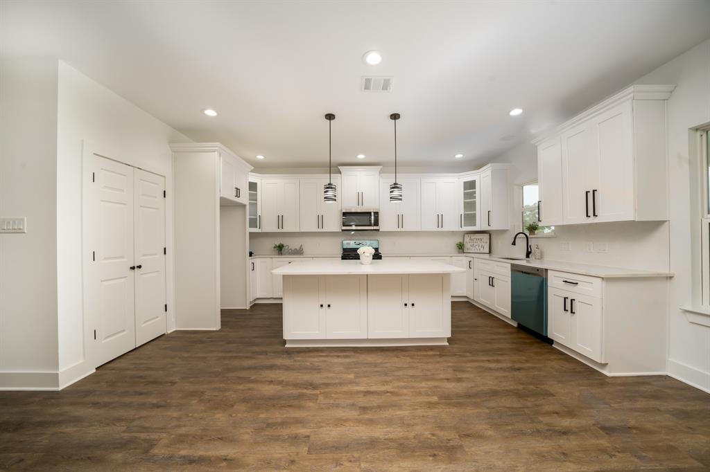 Large pantry and island has both cabinets and large storage drawers.