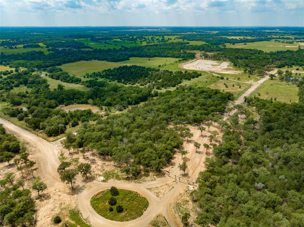 Welcome to Tierra Escondida, your hidden land oasis located in the heart of Bastrop County, Texas. Strategically positioned between Bastrop and Giddings, Texas, Tierra Escondida offers 21 tracts the perfect opportunity to start your legacy while remaining near area amenities. The subdivision consists of 21 tracts ranging from 10-15 acres, providing plenty of space to build the home of your dreams and enjoy the beauty of the surrounding area. Bosque Verde (Tract 1) is located north of the circle drive as you enter the main gated entry of the development. This heavily wooded 12.756-acre tract allows for flexibility in design with numerous options for homesite placement. Electricity is available and homesites will need a water well and septic for utilities. Tierra Escondida offers a unique opportunity to own a piece of land in a serene and tranquil setting, perfect for those seeking a peaceful retreat. Don't miss this chance to begin your legacy in this hidden land oasis.