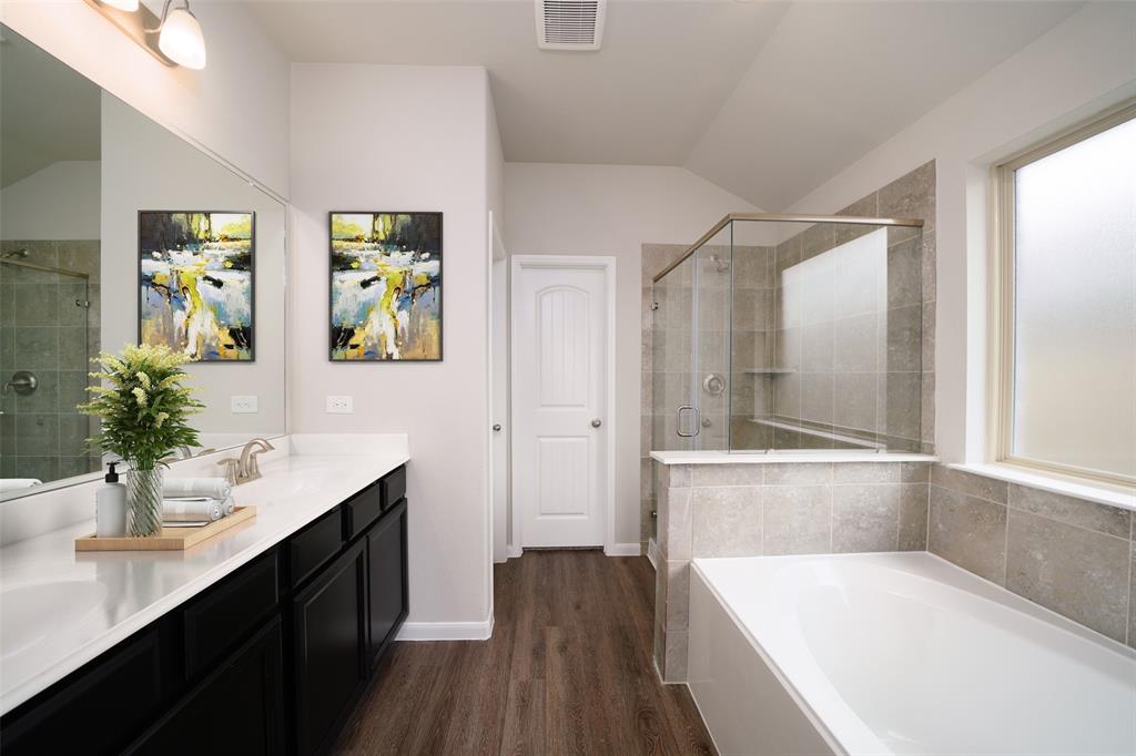 **Home is Under Construction. The photo shown here is of a completed home that has the same floor plan and similar elevation. Options and color selections may vary.**