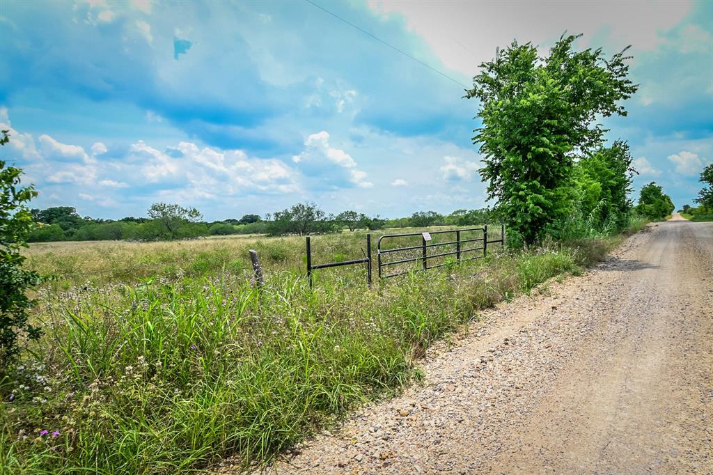 Now available 10.01 acres on a secluded gravel county road, centrally located between Houston, Austin, San Antonio north of IH-10. The property is mostly open with scattered mesquite trees through the pasture with oak trees along the creek. This layout provides a great location for your homesite. Fencing is up along the boundary line boarding the county road with a nice point of access entrance, other perimeter fencing is needed. Electricity in an easement along the county road and readily available. Water and sewer are needed. Light deed restrictions to maintain property values. No mobile homes, no pigs or peacocks, no commercial signs, no junk cars, and only single family homes allowed.