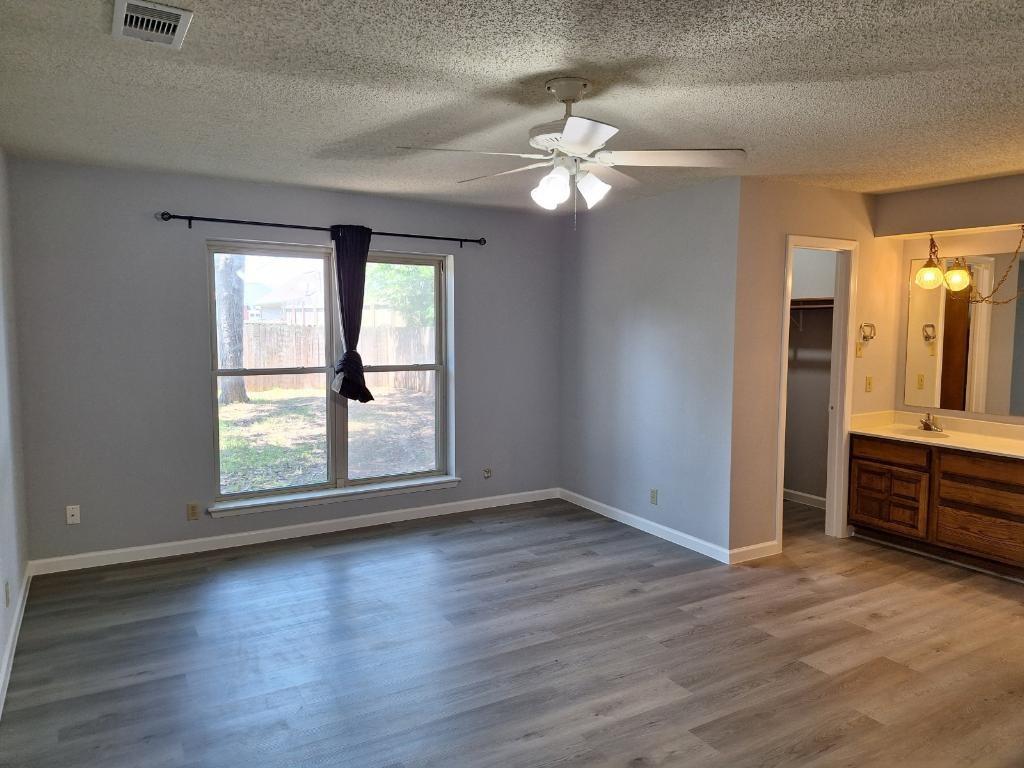 Primary bedroom with walk in closet