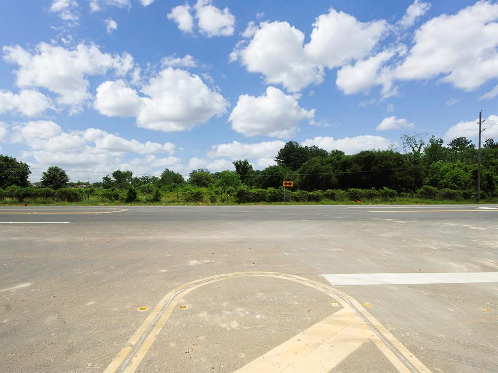 A look from across FM 359 towards the front of the property shows all of the frontage along FM 359.