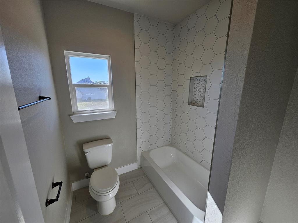 Downstairs guest bath accessible via family area AND office/guest bedroom