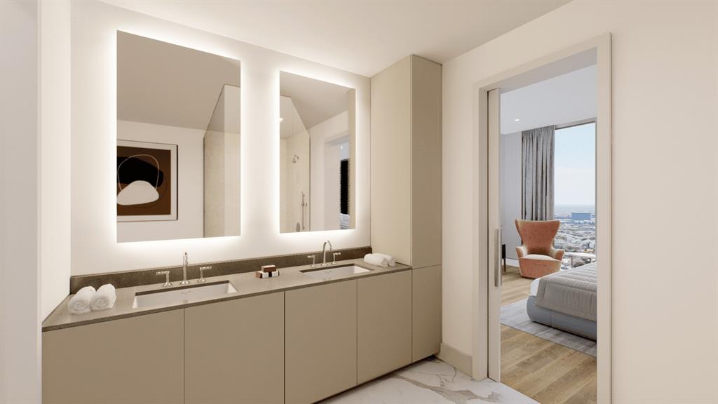 Experience luxury in the primary bathroom. Immerse yourself in sophistication with exquisite finishes, a spacious layout, and lavish amenities for a truly indulgent bathing experience.