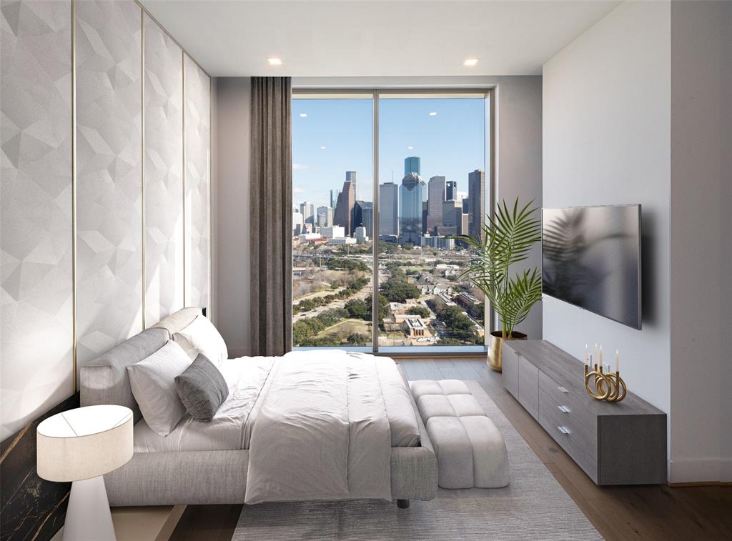 Secondary bedroom features ensuite with downtown views.