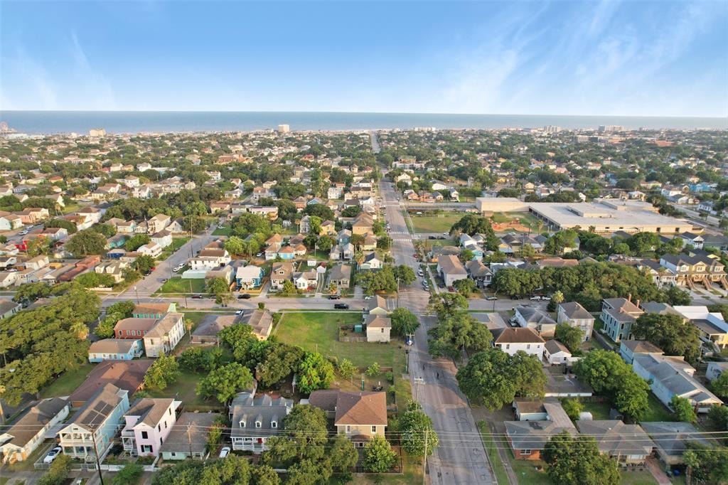 An aerial view of the property highlights the location of this large corner lot in Galveston\'s midtown district - just two block south of Broadway, 1.5 miles to the Strand District, and 14 blocks north of the sandy shores of Galveston Beach near the Pleasure Pier.