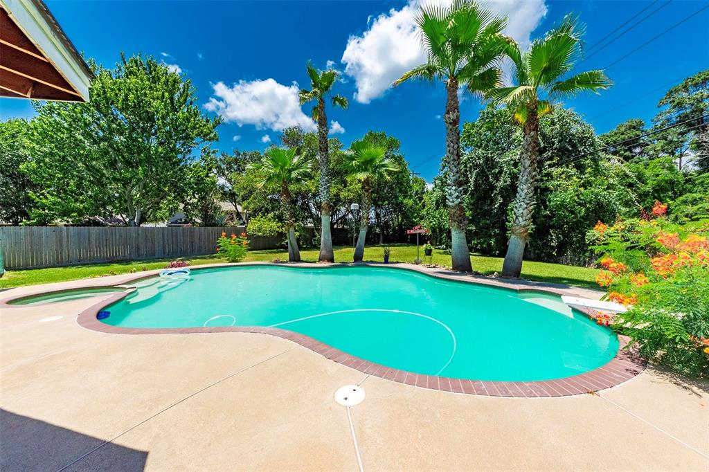 Your Own Tropical Private Backyard Retreat!  Another view of this stunning backyard swimming pool!  Recent updates include pool heater, pool pump and pool lights.