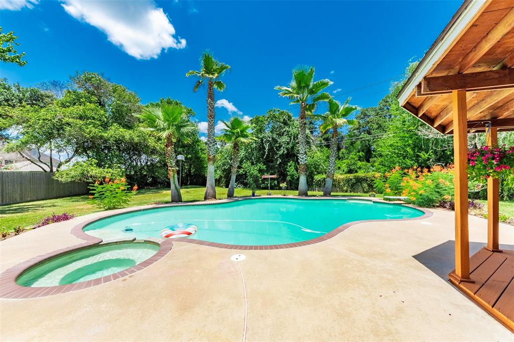 Just in time for Summer!  Extra large sparkling swimming pool and hot tub in this private backyard retreat with mature trees and NO BACK NEIGHBORS!