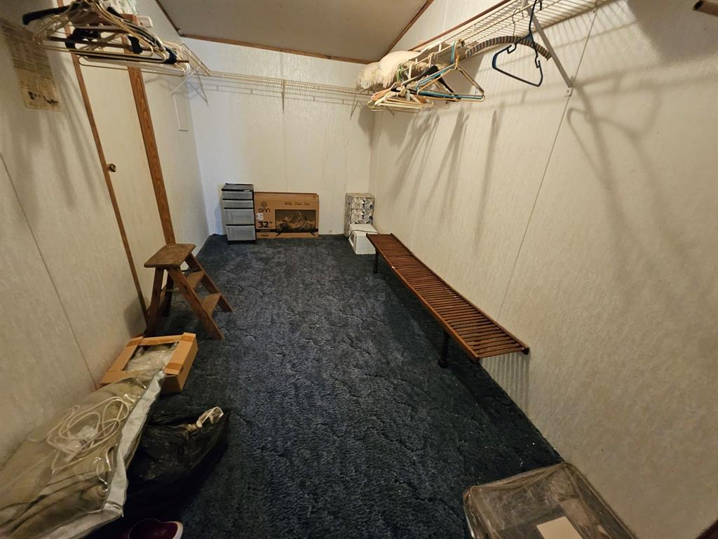 Very spacious primary closet off of the sitting area and bathroom