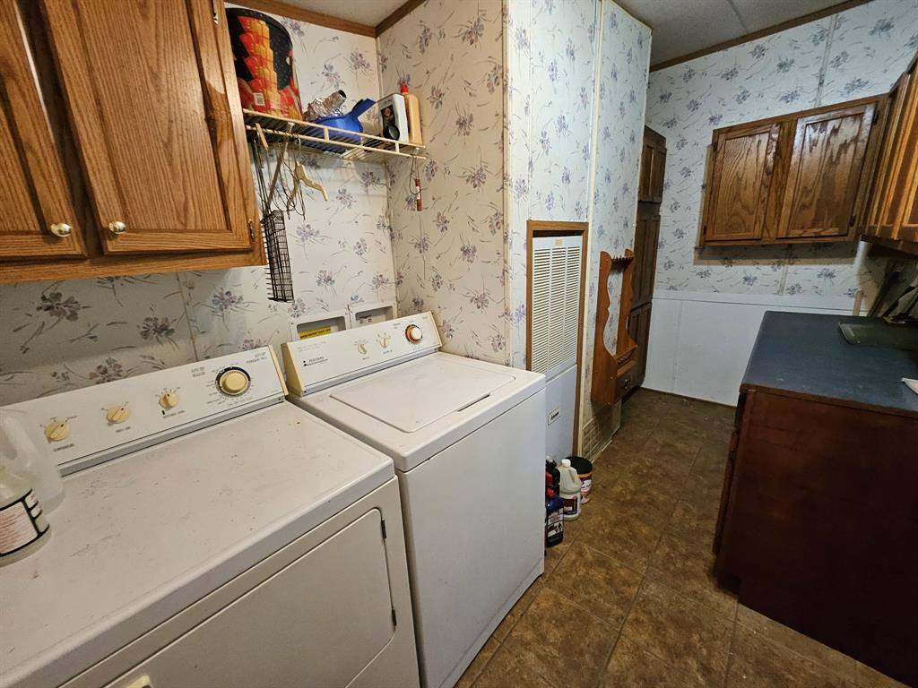 Plenty of storage space in the laundry room off the kitchen