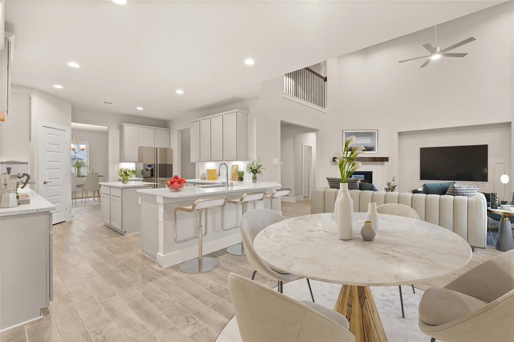 Start your day off right with a cup of coffee sitting with your family in the lovely breakfast area! Featuring large windows with blinds, custom neutral paint, tile flooring and recessed lighting.