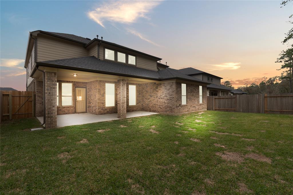 Come and see this spacious backyard with its beautiful covered patio. There is plenty of room for the kids to play and adults to relax! Perfect for your outdoor living space, patio furniture, bbq pit, and so much more. The possibilities are endless!
