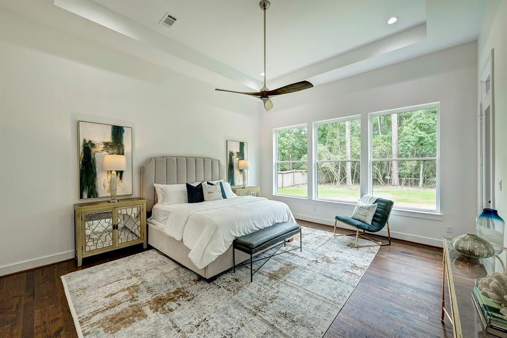 Live like royalty in this expansive owner\'s retreat! A wall of windows carries natural light up to the raised ceiling. Space for a sitting area and a glass door connect to an outdoor patio.