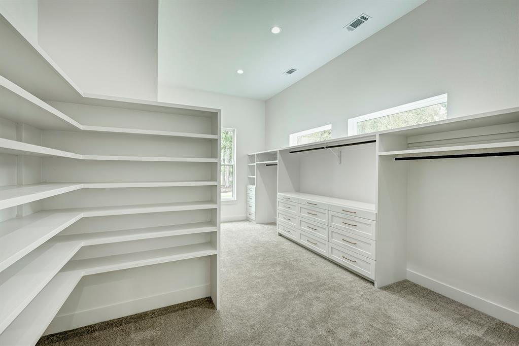 Get dressed in style in your private dressing room! Complete with multiple hanging rods, drawers, and shoe shelves.
