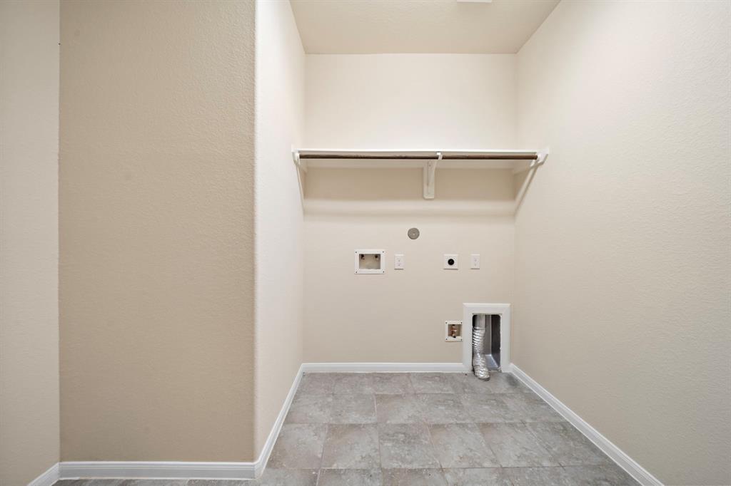 Utility Room with electric & gas hookups for dryer, also has a nook for a 2nd fridge or freezer