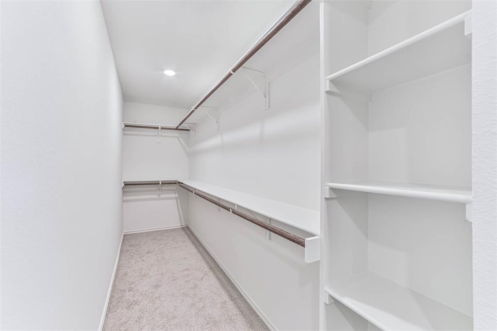 Walk-in closet is ample for all your needs.