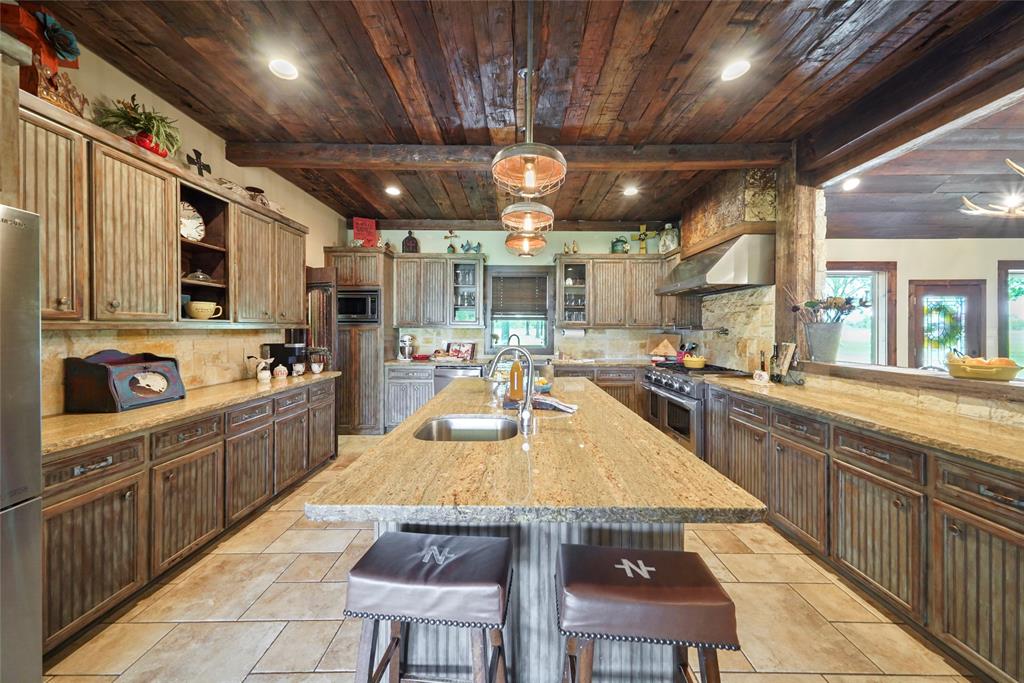 Oversized kitchen with Travertine Tile Floors, Second Sink, Pot Filler, Gas Range and So much More!