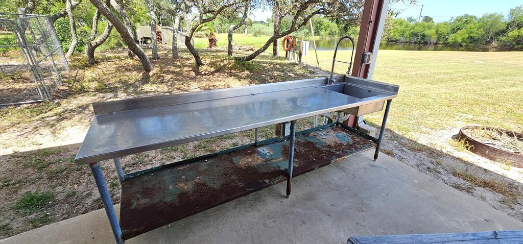 Stainless steel fish cleaning table. Show off your catch of the day! Stand behind it and take photos with your fish.
