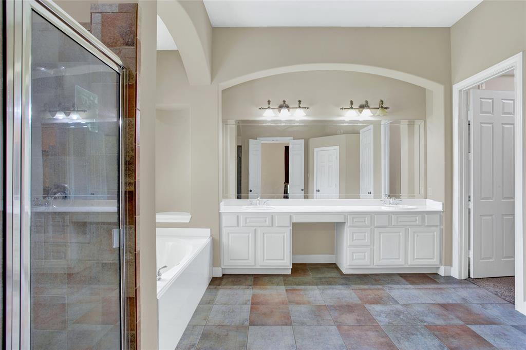 Ensuite featuring double sinks