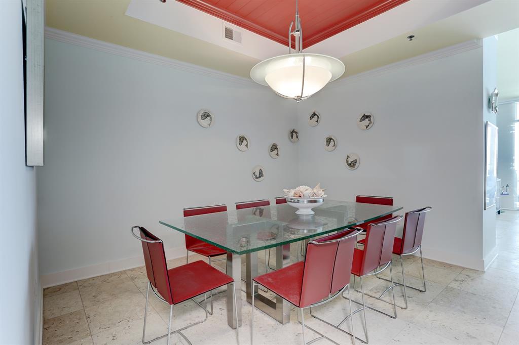 The Dining Area offers a vast space that can comfortably accommodate all your guests. Adorned with a custom light fixture and featuring a special ceiling treatment, this expansive dining roommakes it the perfect setting for memorable gatherings and delightful culinary experiences.