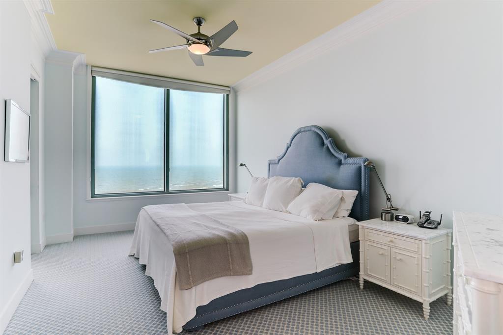 The Primary Bedroom offers a sense of luxury with a large picture window, private balcony access, and an en suite bath. Beautiful carpeting adds a touch of comfort, while black-out window coverings ensure a restful and peaceful night\'s sleep.