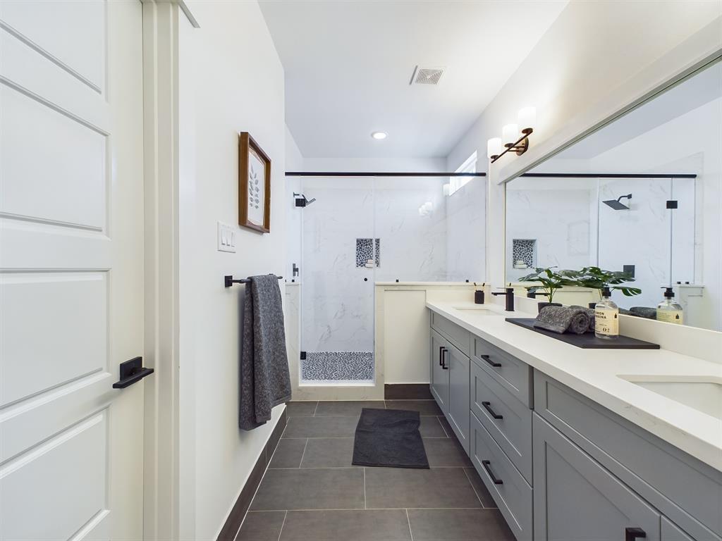 MOVE-IN READY! Offering a beautiful primary bathroom with a walk-in shower and double sink vanity with quartz countertops. FINISHES & FLOOR PLANS MAY VARY!