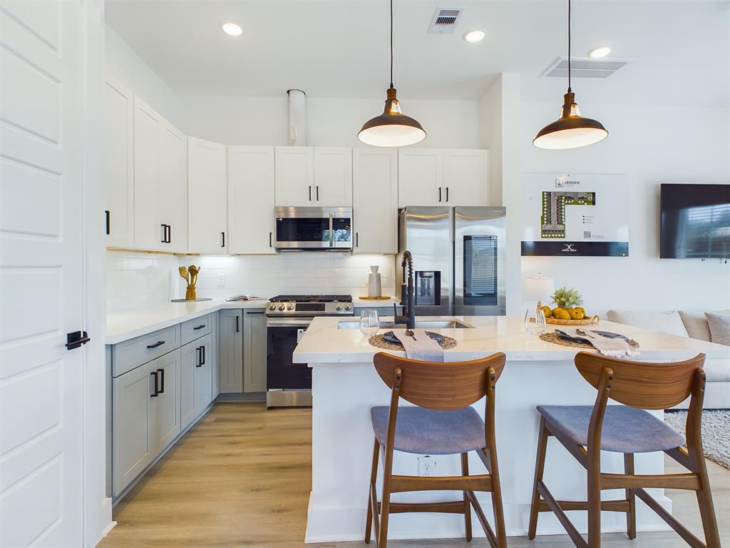 MOVE-IN READY! High-end interior finishes including quartz countertops, big kitchen island, stainless-steel appliances, upgraded cabinets with soft close drawers. FINISHES & FLOOR PLANS WILL VARY! Ceiling fans are not included!