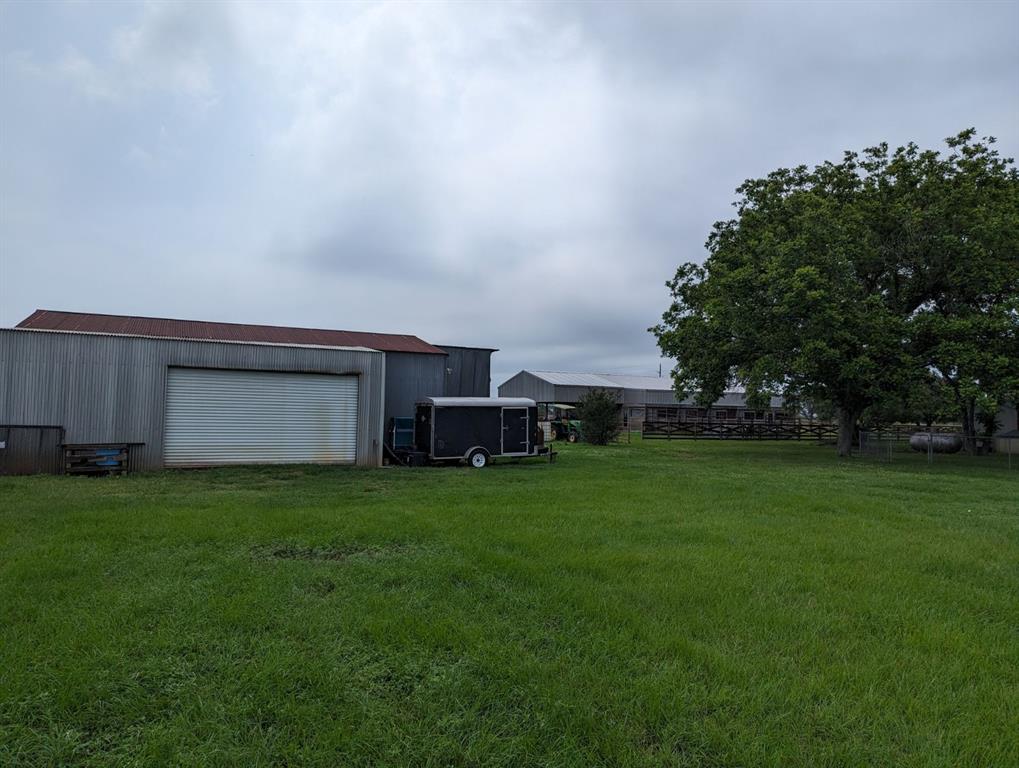 Side View of Shop, with Barn in the Background