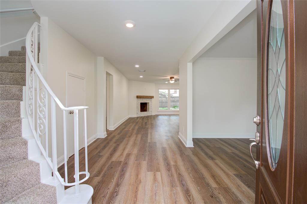 The formal entryway flows seamlessly into the family room as well as the formal living room.
