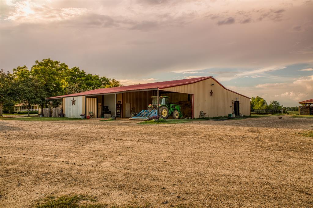 This barn offers plenty of space for ALL your needs! Dimensions are approximately 90\'x72\' offering 14 horse stalls with 8 ceiling fans, a storage/tack room measuring 38\'x10\', a tool room located under the apartment at 13\'x19\', an additional work space adjacent to the tool room, an office/art room measuring 13\'x10\' w/half bath & the covered outdoor storage- perfect for tractors, mowers, accessories & everything outdoors.