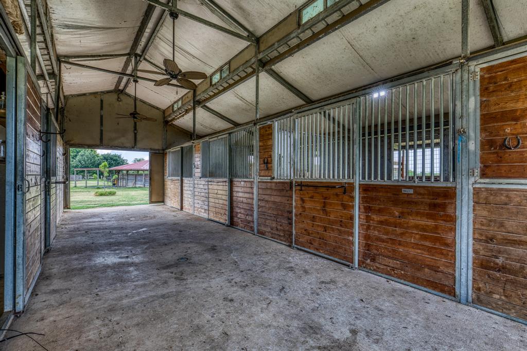 Barn 2, 9 horse stalls, 3 fans, tack room, storage room, efficiency apartment.