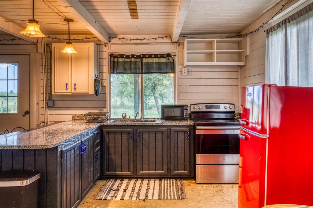 Updated kitchen w/new appliances. Granite counter tops. Covered deck w/fenced yard just outside kitchen window.