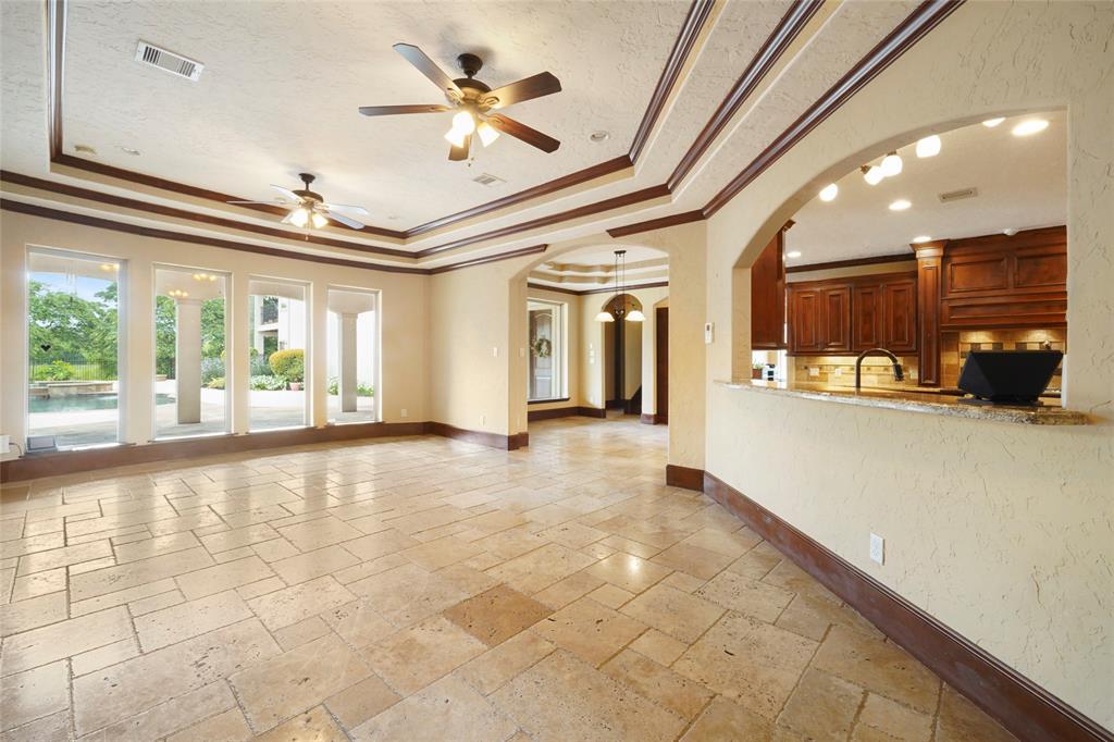 Gorgeous flooring seen throughout and in Family room with fireplace and open to the kitchen