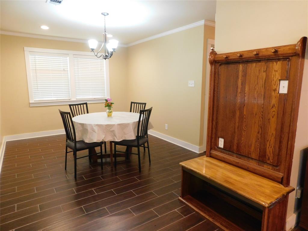 Dining room with beautiful custom bench in foyer area...