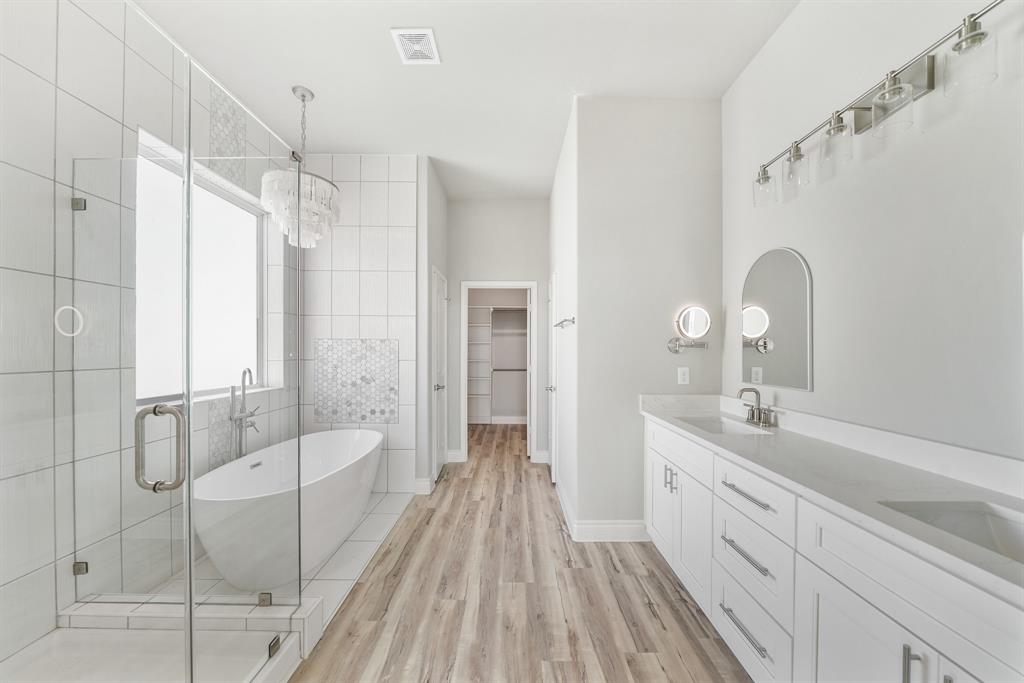 Check out the primary bathroom! Large soaker tub surrounded by beautiful tile from floor to ceiling!