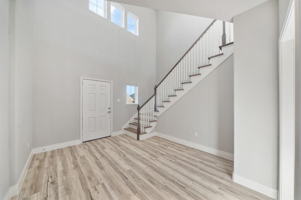 Entry to the first floor features a large & open foyer!