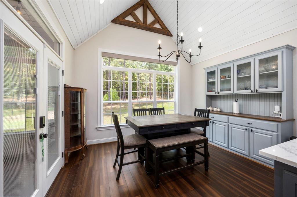 Enjoy meals or conversation in the spacious breakfast room while admiring views of the tranquil wooded backyard. Bonus features include custom built cabinetry and wood counters for all your storage needs.