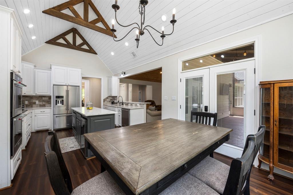 Enjoy meals or conversation in the spacious breakfast room while admiring views of the tranquil wooded backyard. Bonus features include custom built cabinetry and wood counters for all your storage needs.