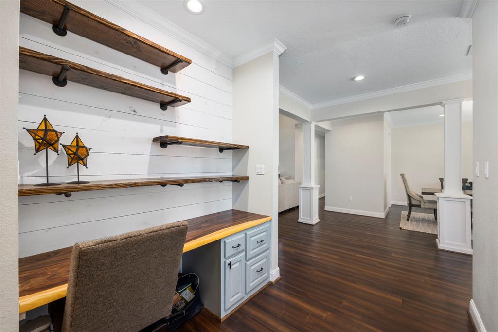 One of the unique features of this property is the built-in desk, with a beautiful wood top. Perfect for setting up your home office or workspace.