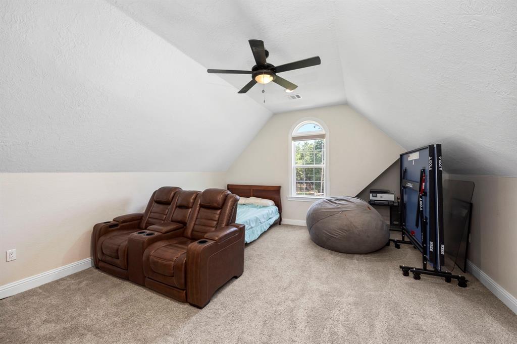 Upstairs, you can find an extra bonus space perfect for whatever you desire; use it as a fifth bedroom or game room – the options are endless! Not to mention this space also features its own private half bathroom and large closet.