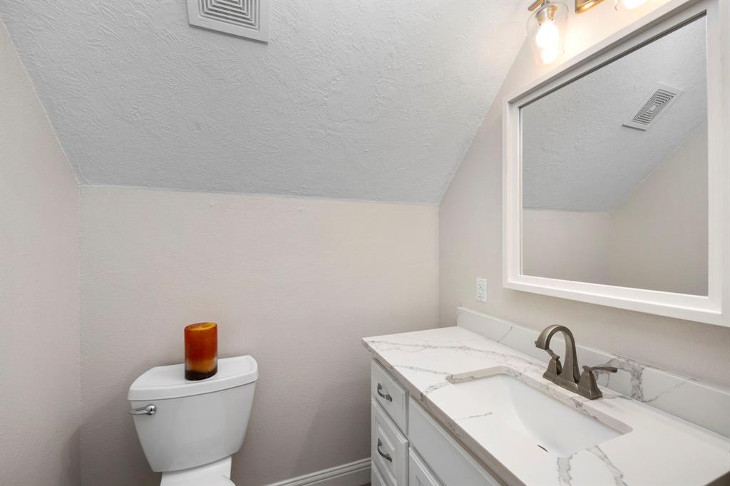 Half bathroom located on the second floor between the theater room and bonus room