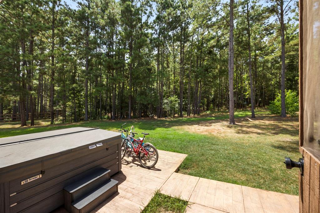 Beautifully stamped concrete pad holds your own private large spa - perfect for unwinding after a long day or just enjoying the scenery.