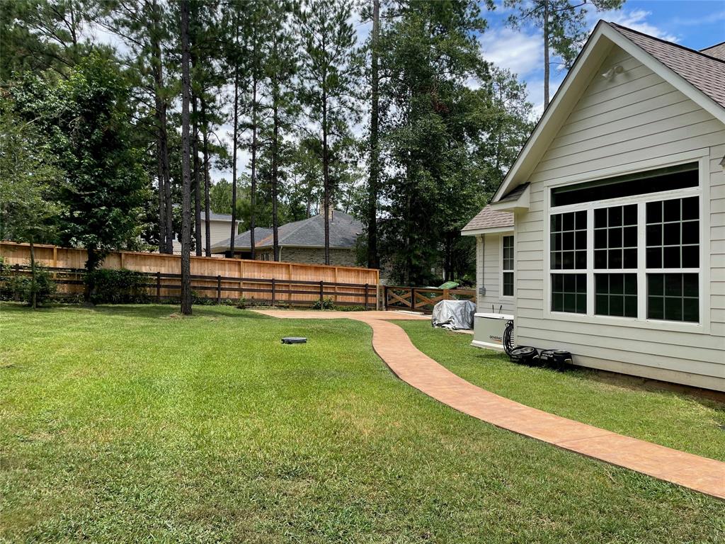 Custom built and stamped RV/Boat concrete pad and walkway leading to the home and spa. 30 amp plug located next to the pad for your RV needs.