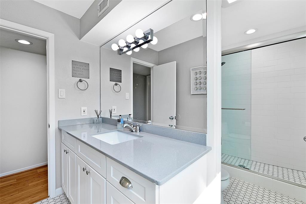 Vanity and shower are in separate rooms.
