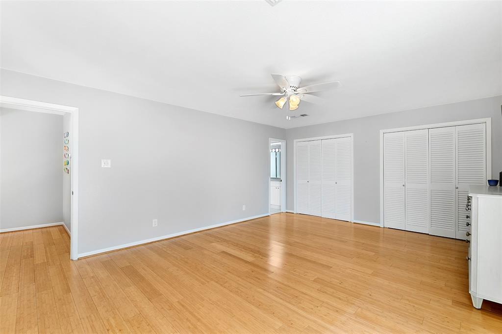 This spacious room offers 2 closets and access to the bathroom.